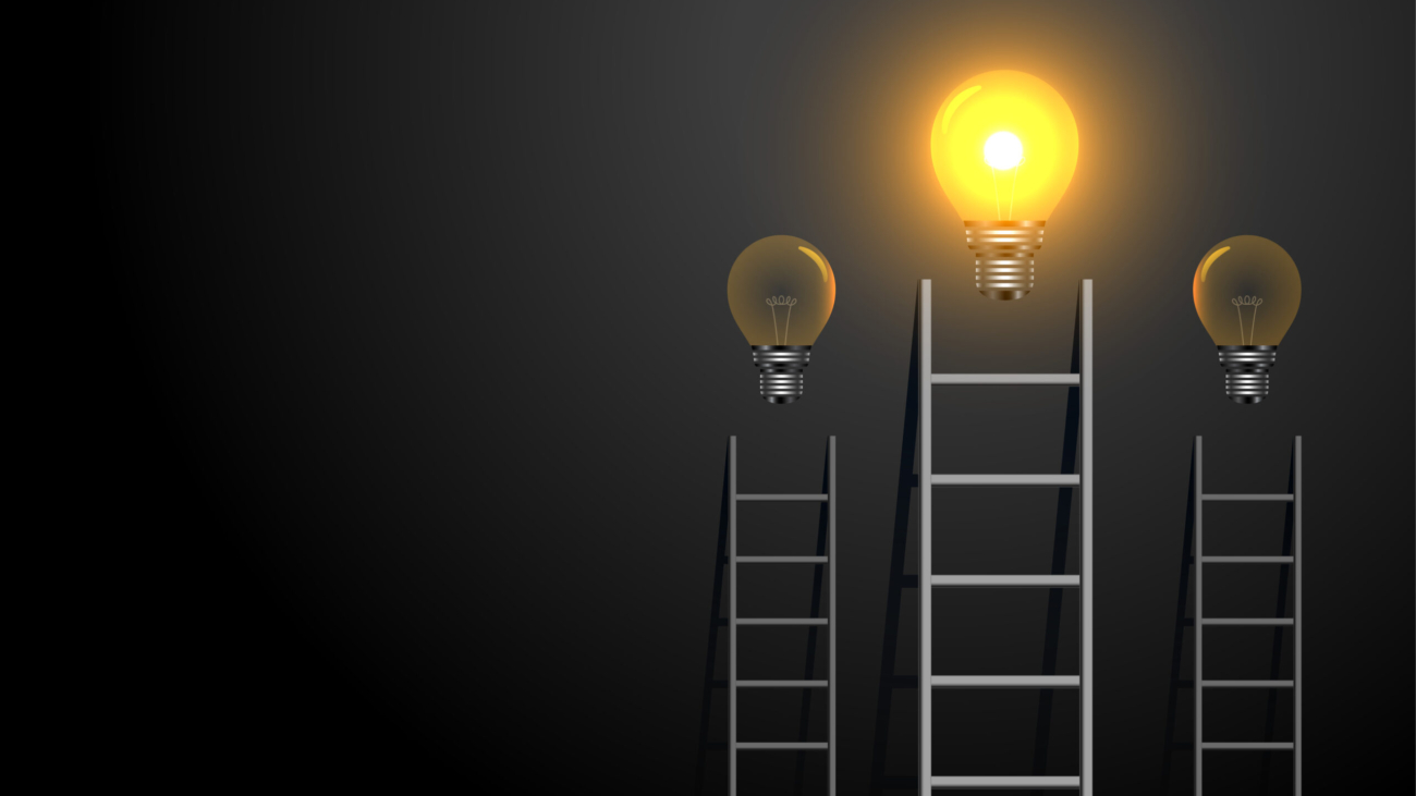 success concept ladder with glowing light bulb