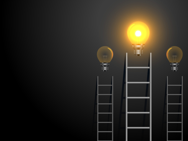 success concept ladder with glowing light bulb